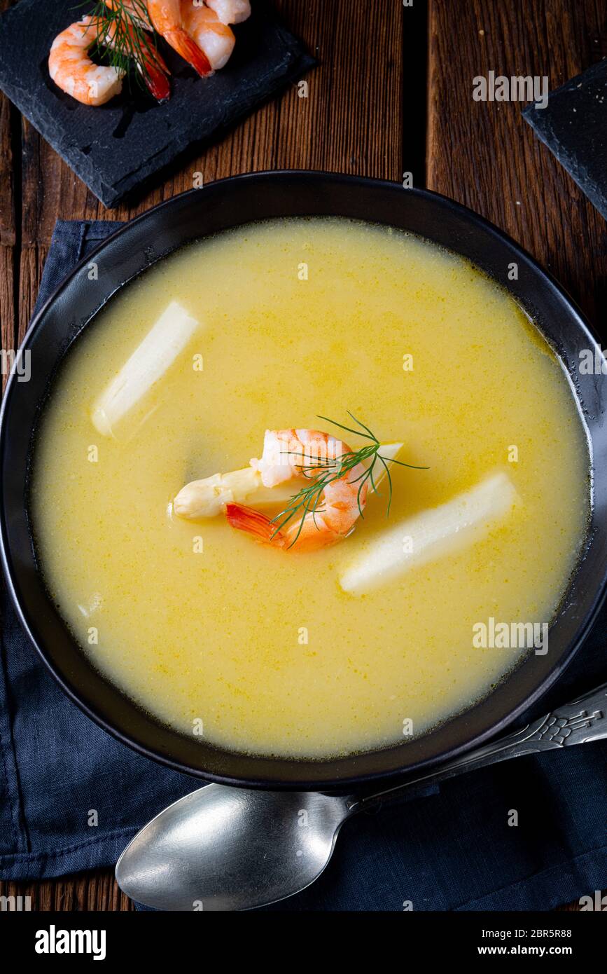 Super delicious asparagus soup with crab and capers Stock Photo - Alamy