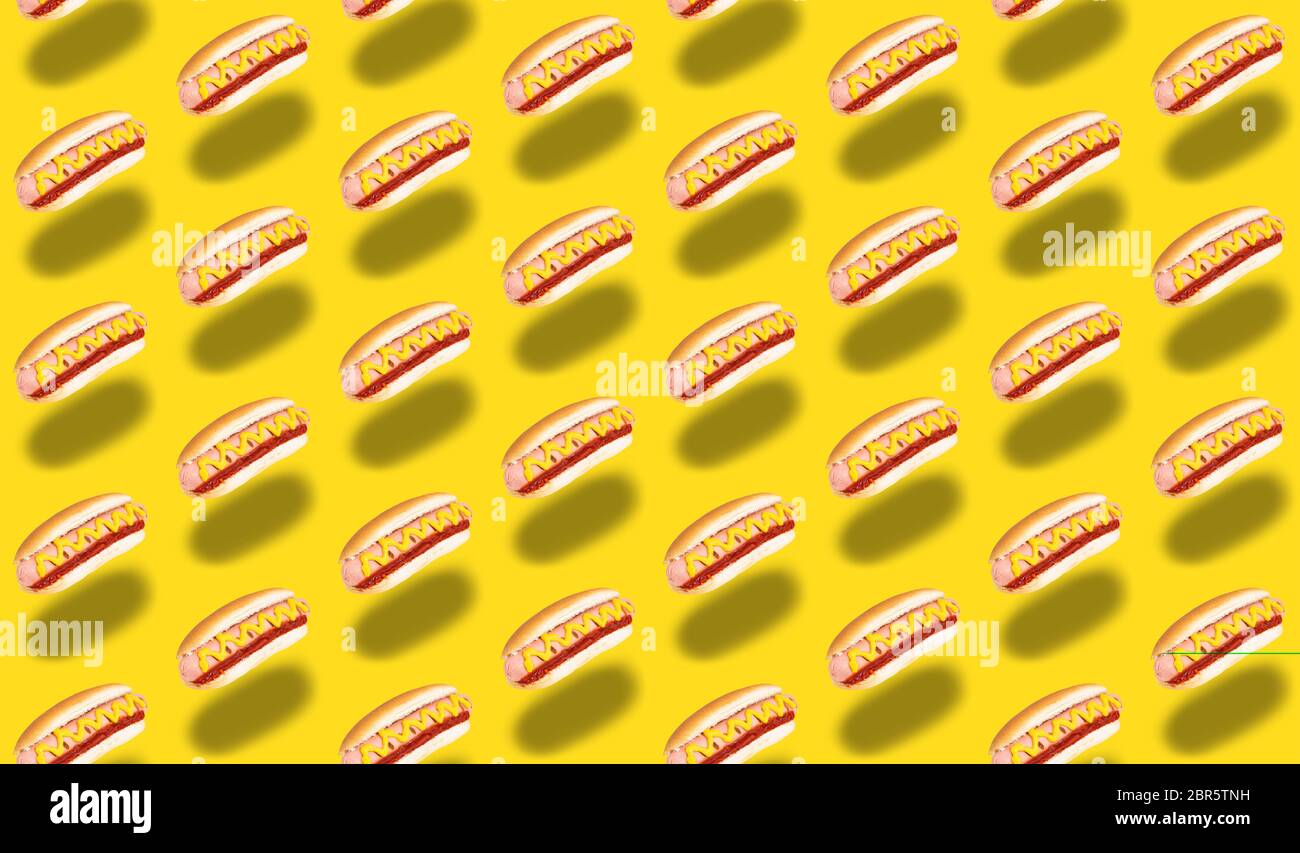 seamless pattern of hot dogs on yellow background. Stock Photo