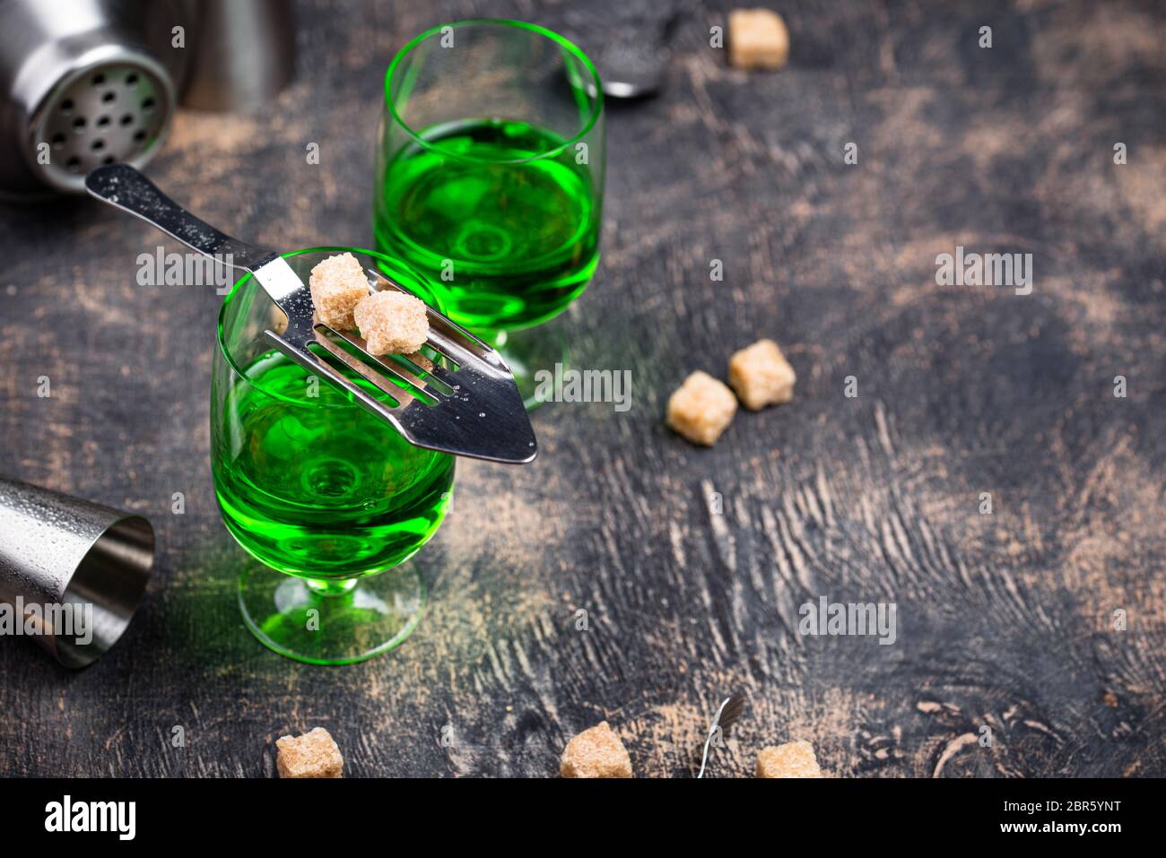 Glass of absinthe with cane sugar Stock Photo