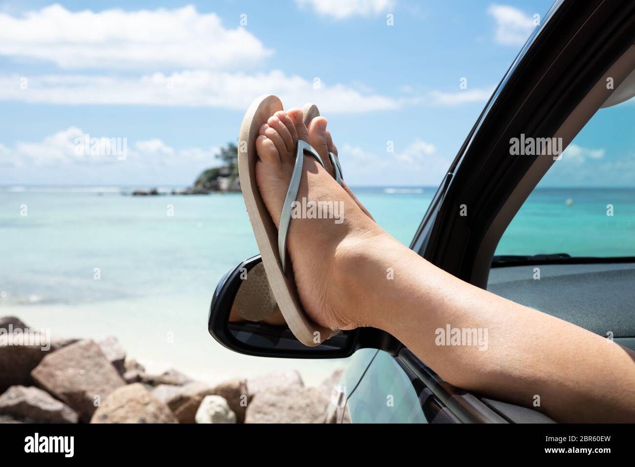 Woman wearing flip flops close up hi-res stock photography and