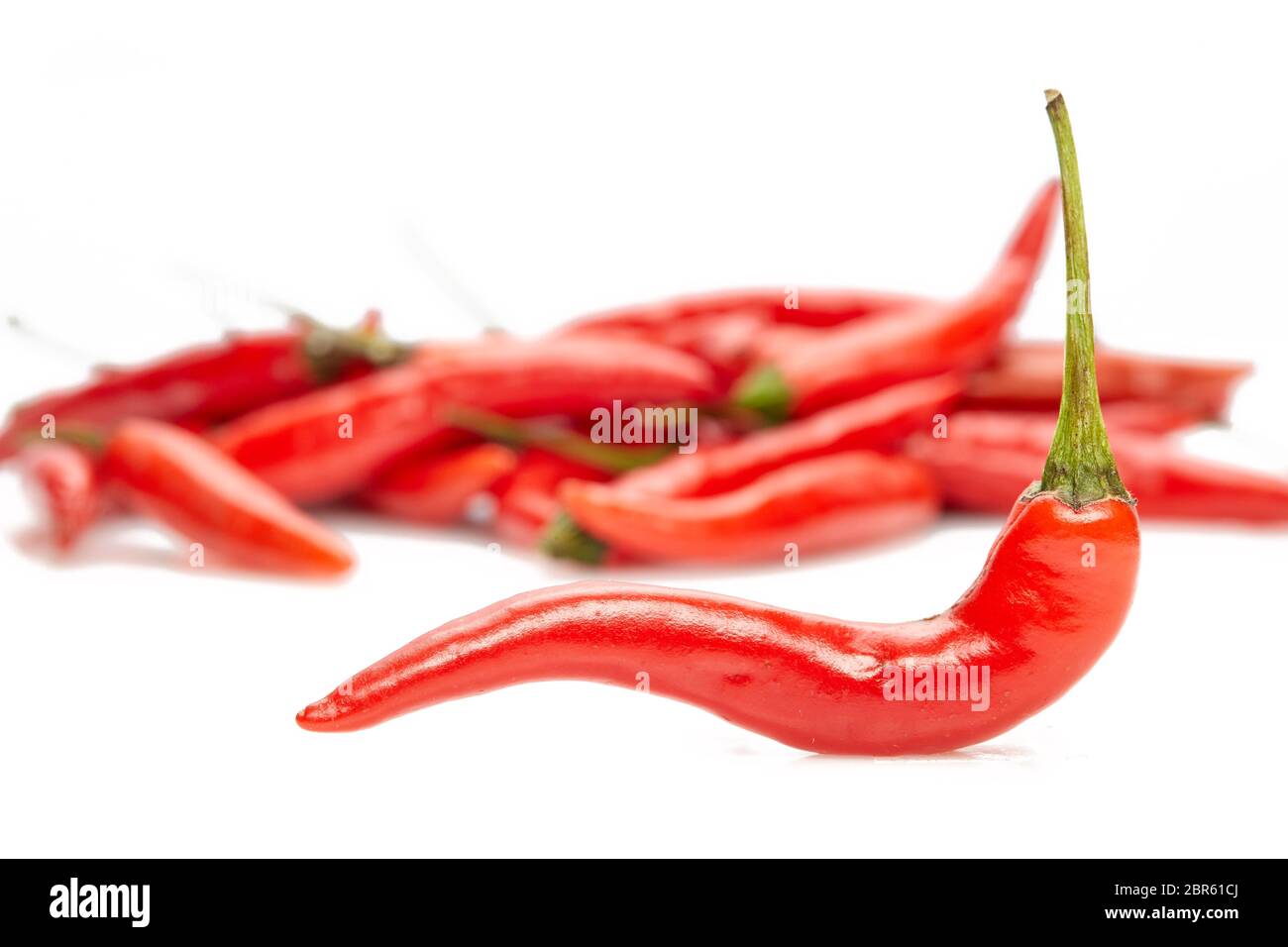 Red hot chili peppers isolated on a white background Stock Photo - Alamy