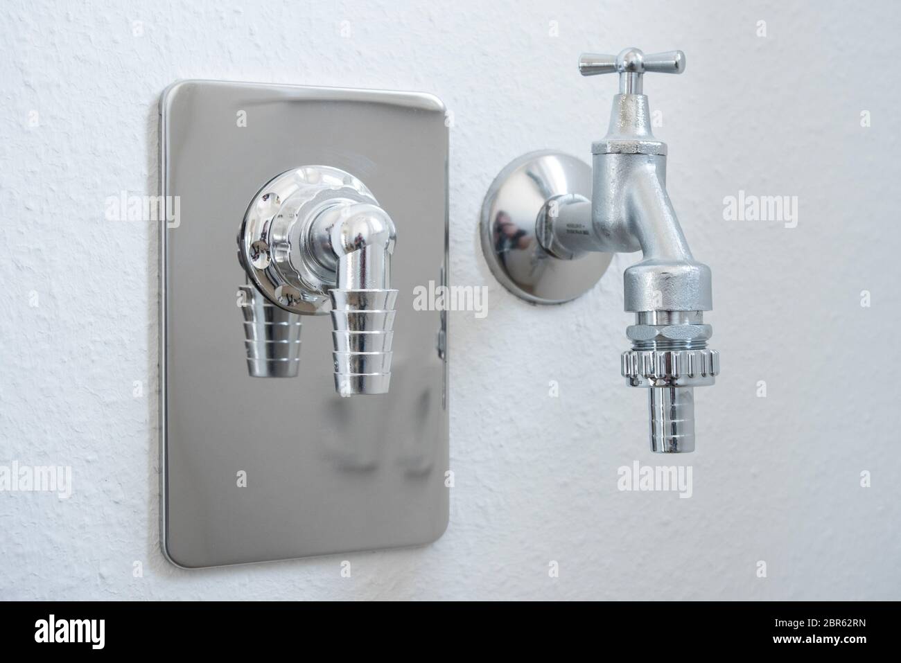 Water tap with hose connection for dish washer or washing machine