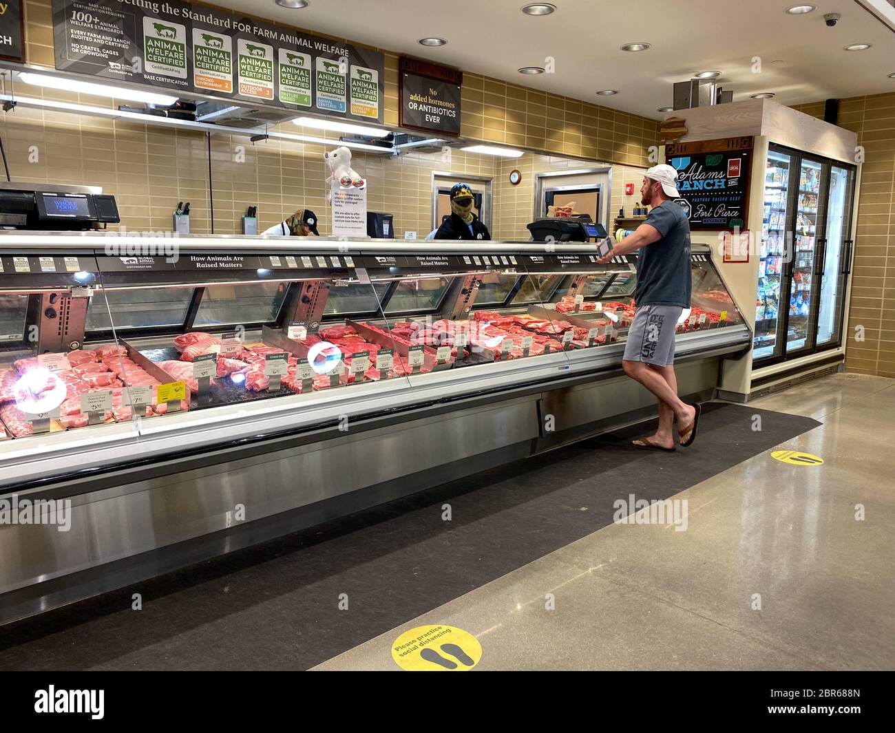 Orlando, FL/USA5/3/20 The meat counter at a Whole Foods Market grocery store with a customer