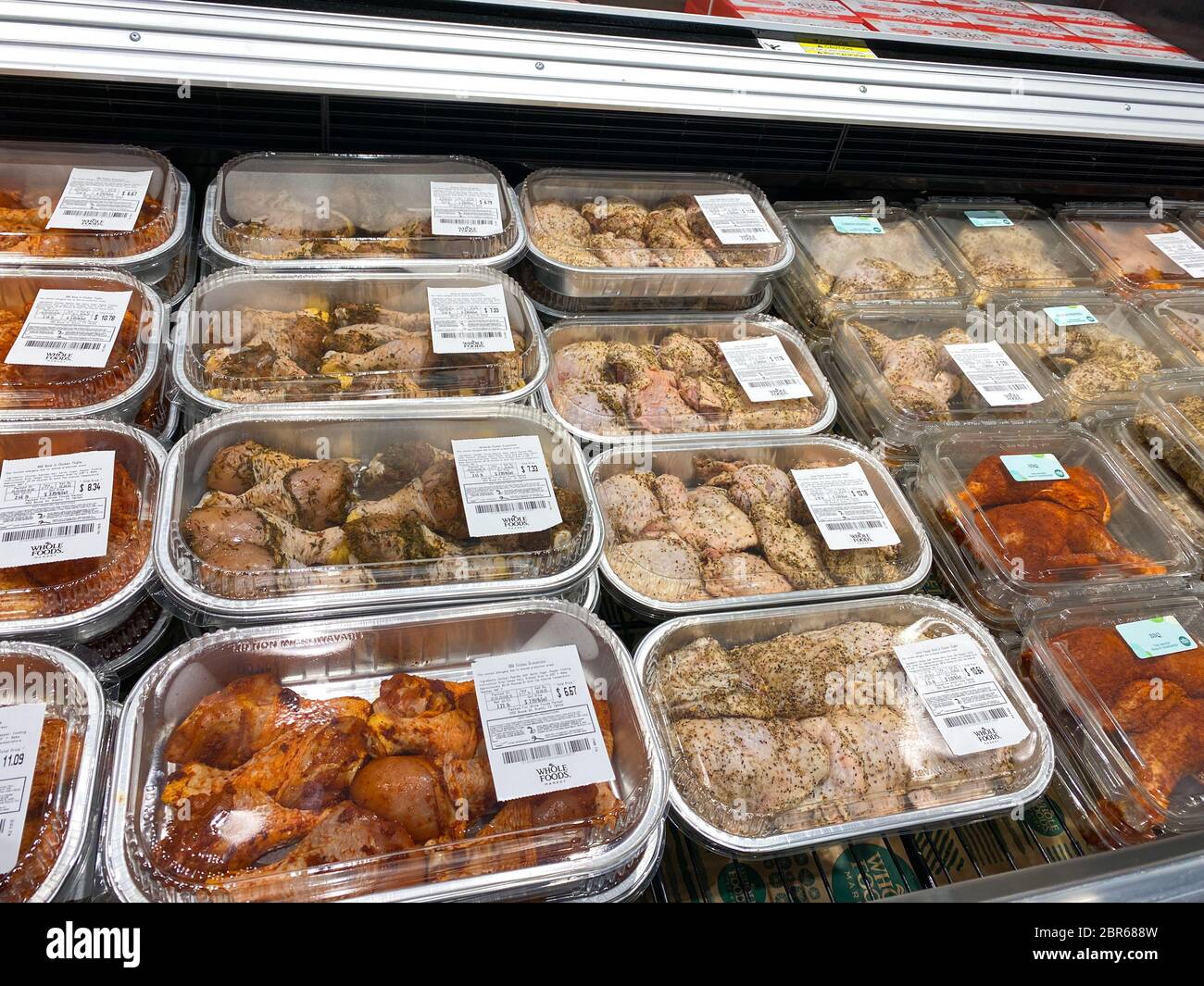 Orlando, FL/USA-5/3/20:  A display of ready to bake chicken dinners at a Whole Foods Market  grocery store waiting for customers to purchase. Stock Photo