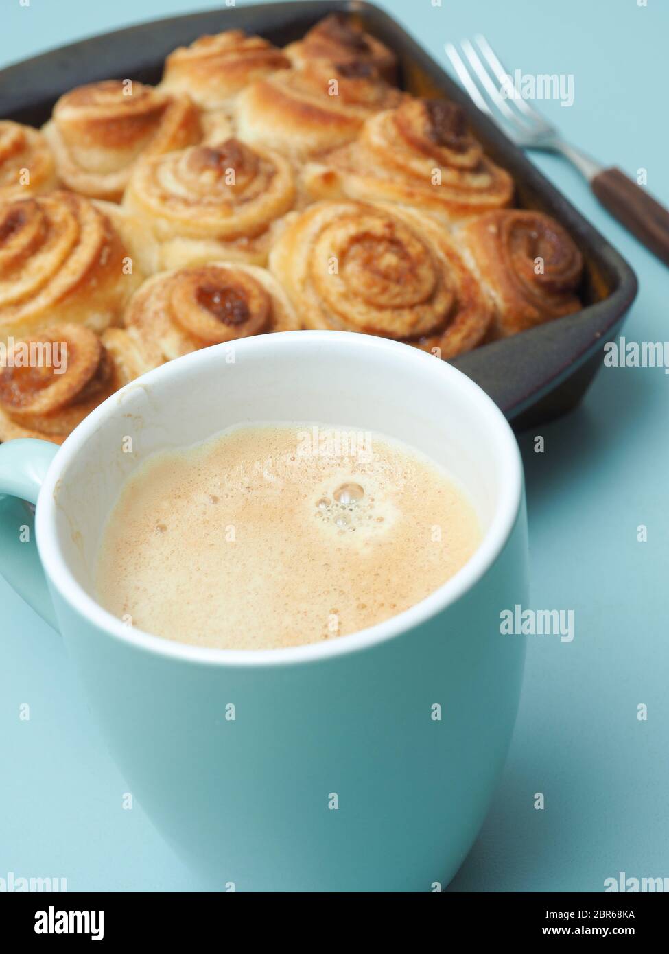 Sweet and tasty cinnamon pastry in a ceramic baking dish Stock Photo