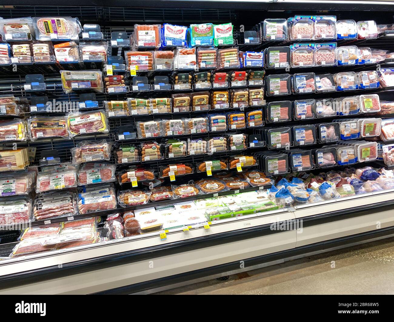 Orlando,FL/USA-5/3/20: A display of various packages of sausages at the meat department of a Whole Foods Market Grocery Store. Stock Photo