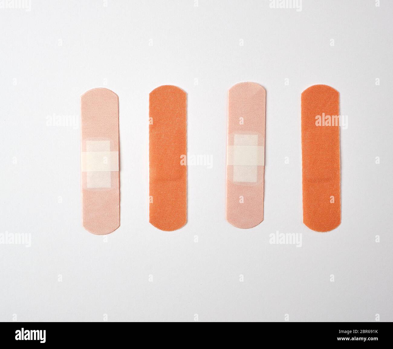 brown textile sticky patch for wounds on the skin of the body, white