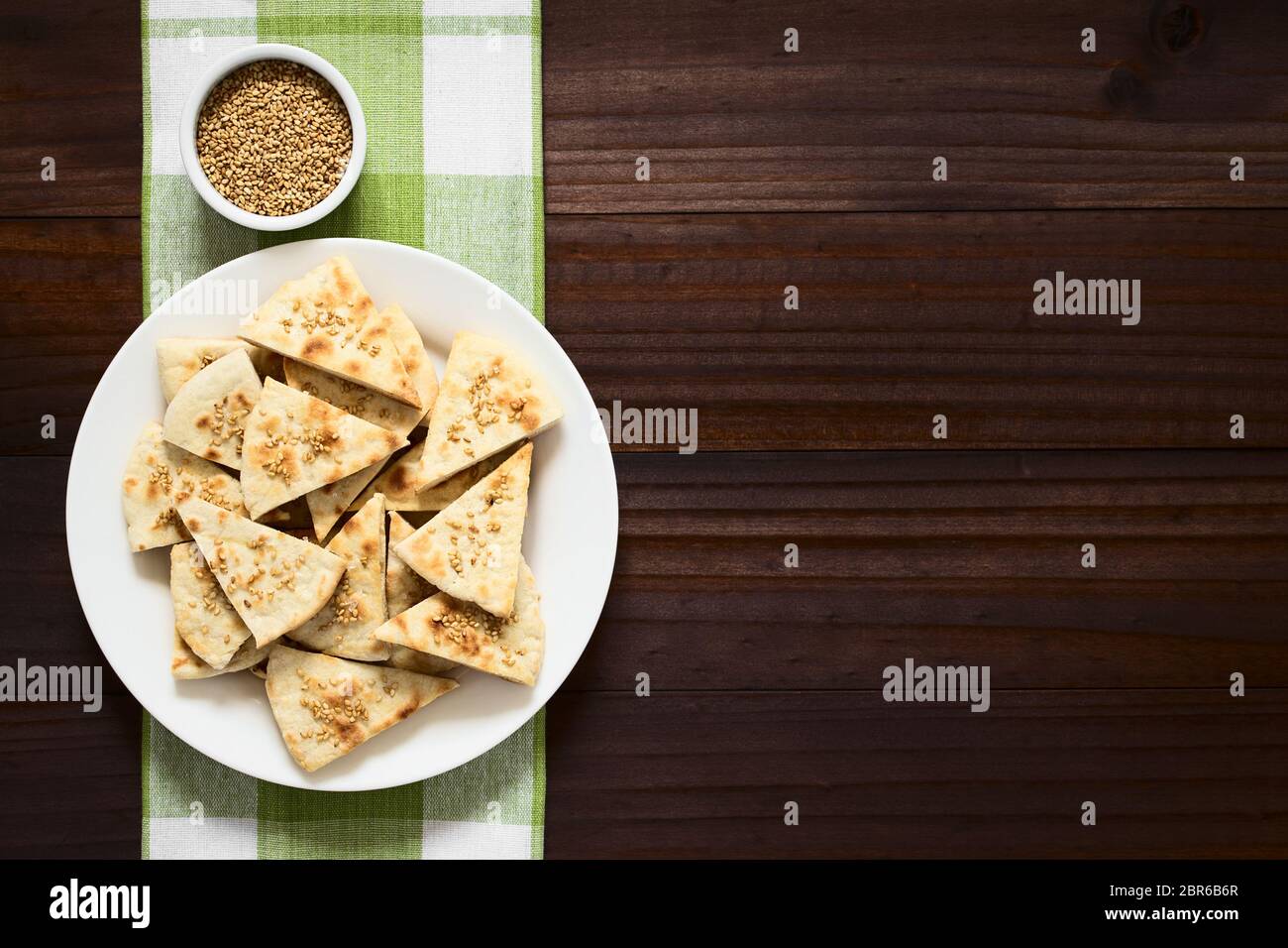 Homemade crispy pita chips with roasted sesame seeds and sea salt