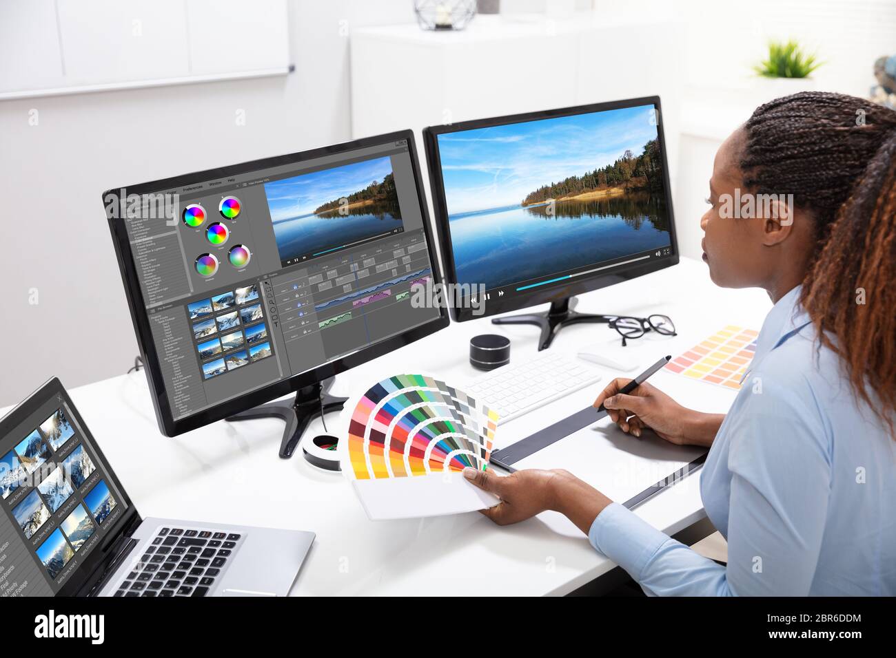 Young Female Editor Editing Video On Computer In Office Stock Photo Alamy