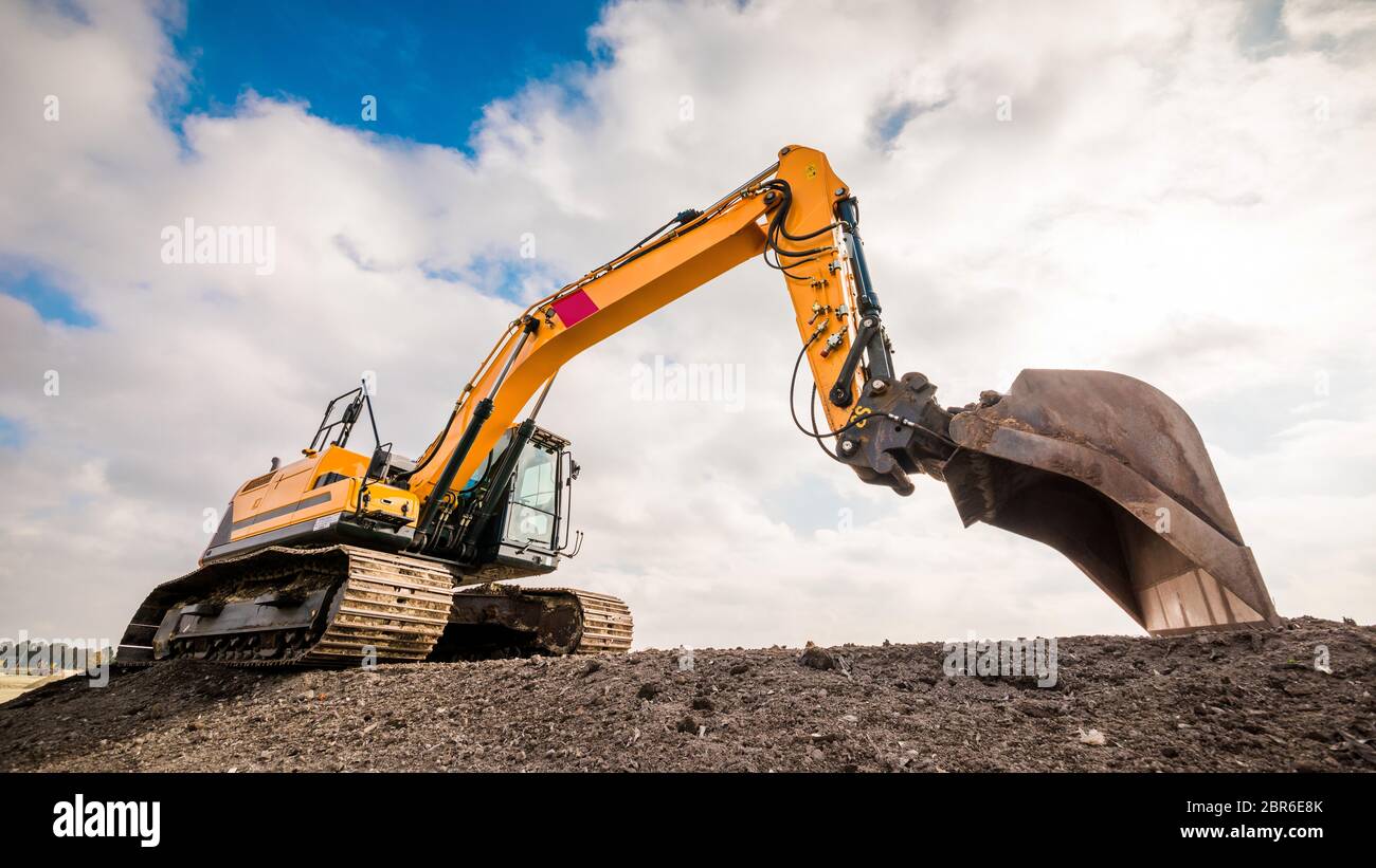 Big excavator in construction site Stock Photo - Alamy