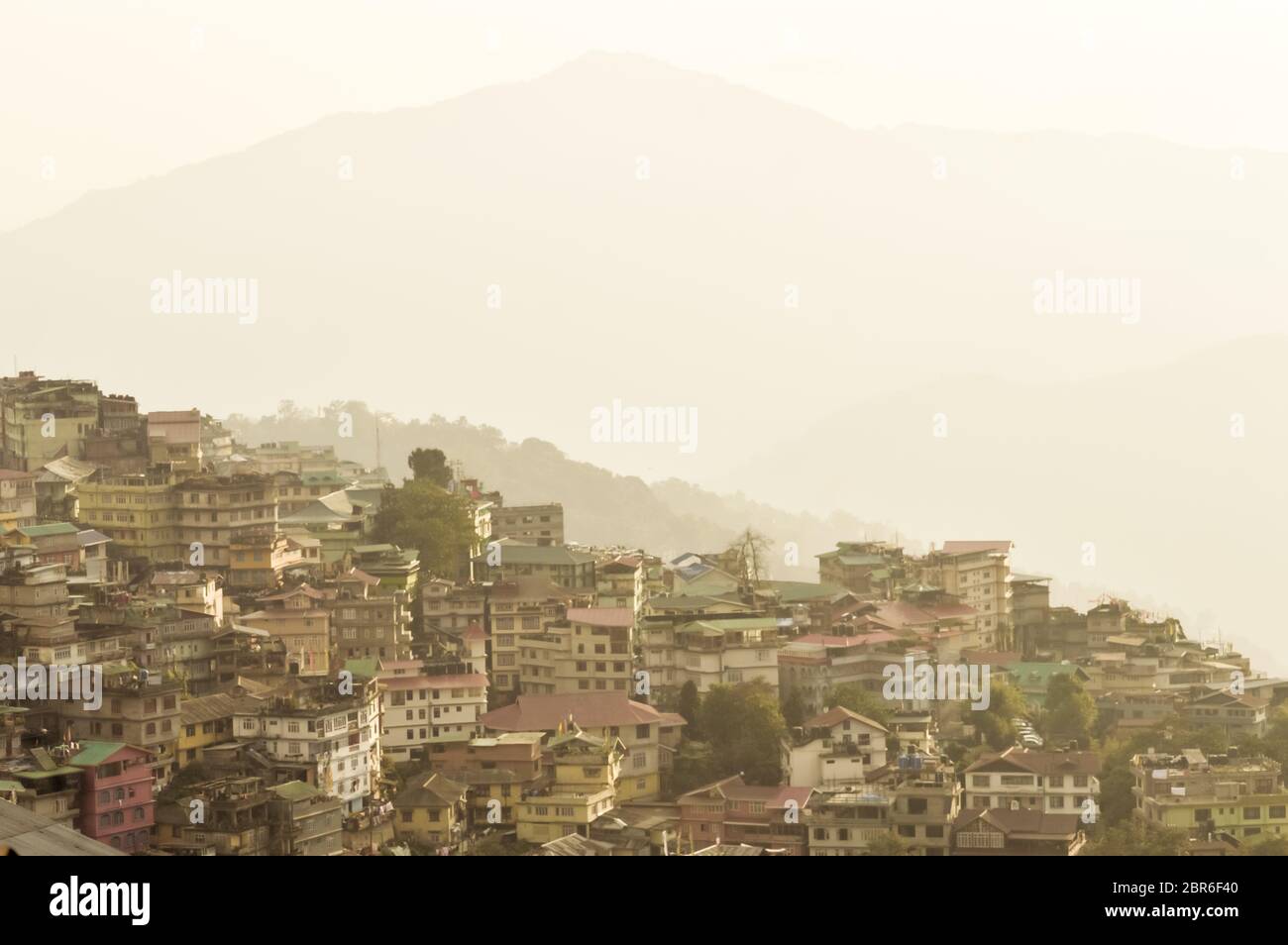 Beautiful panorama view of Gangtok city, largest town of Indian state of Sikkim, located in the eastern Himalayan range in Northern India. Stock Photo