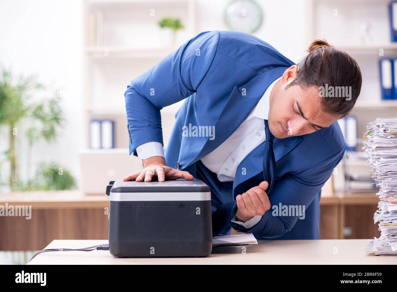 Young Employee Making Copies At Copying Machine Stock Photo Alamy Young Employee Making Copies At Copying Machine Stock Photo Alamy