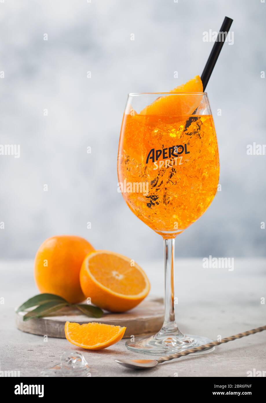 London Uk May 20 2020 Aperol Spritz Aperitivo Summer Cocktail Drink In Original Glass With Oranges And Bar Spoon On Light Table Background Stock Photo Alamy
