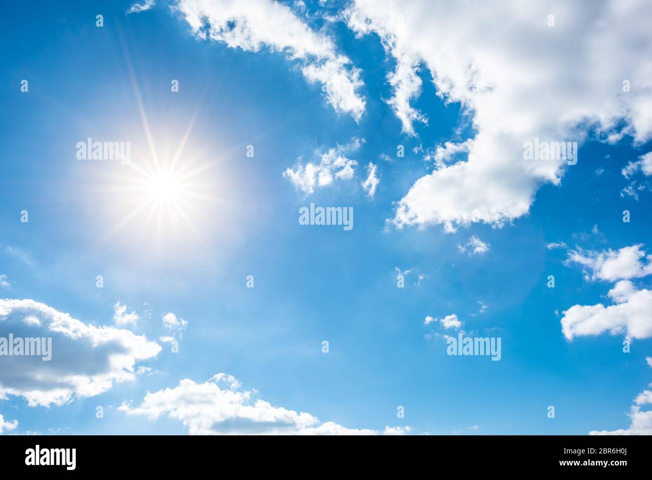 Sunny Background, Blue Sky With White Clouds And Sun Stock Photo - Alamy