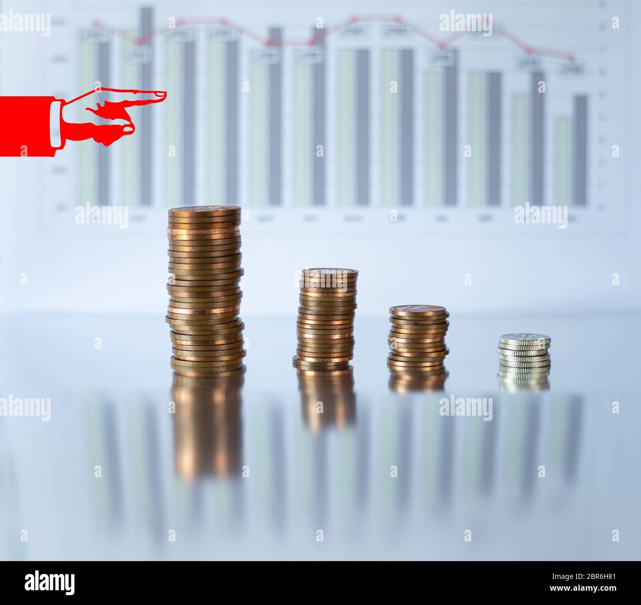 Decreasing piles of coins with red icon of hand pointing out to grath. Concept of financial fall. Economic financial down crisis recession Stock Photo