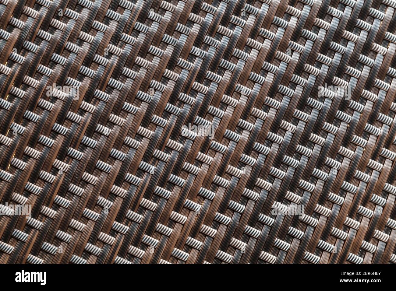 Brown wicker pattern, plastic furniture surface, background photo texture Stock Photo
