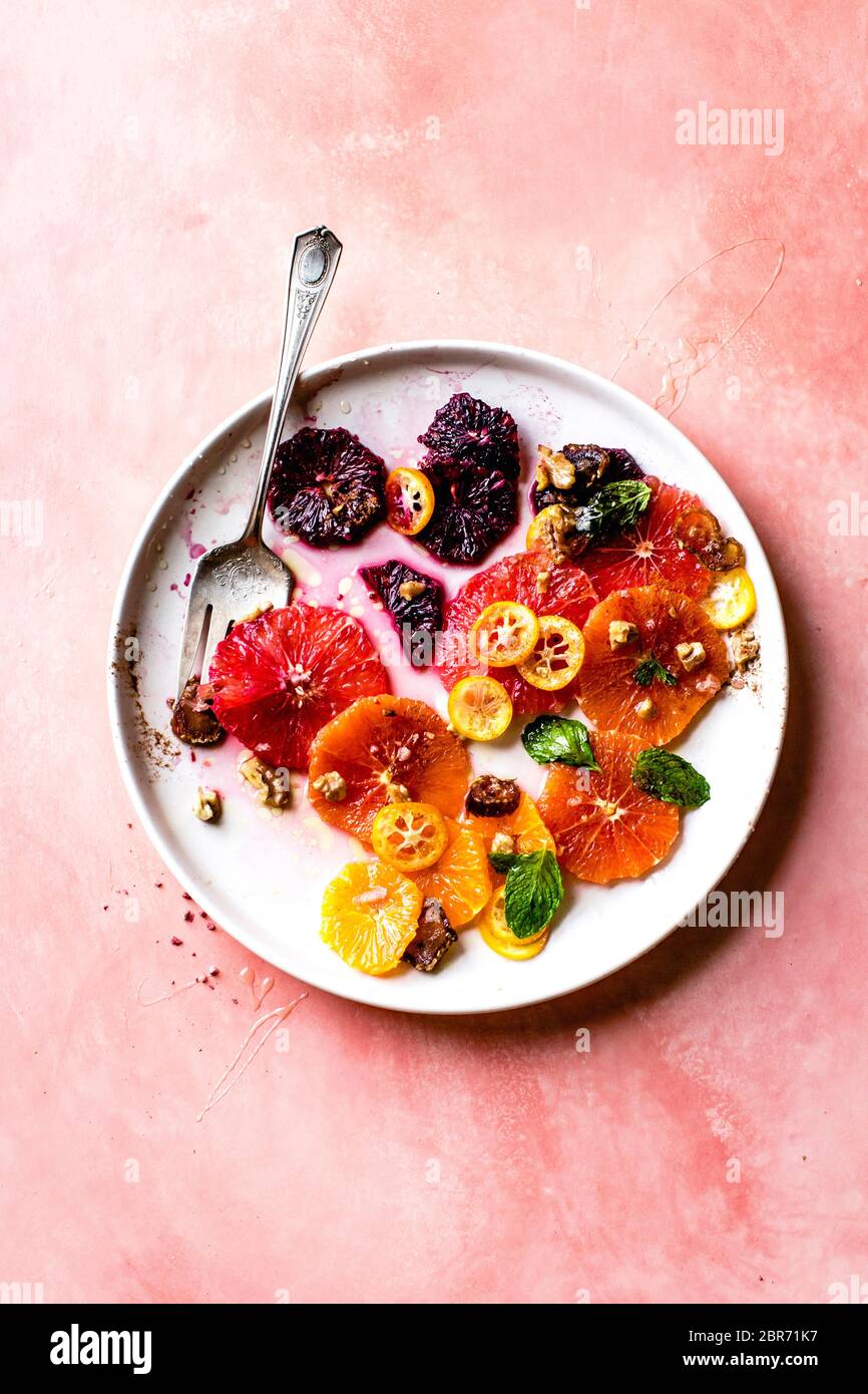 Citrus fruit salad with rosewater, dates, and walnuts. Stock Photo