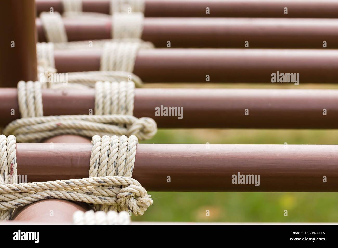 Close up of rope tied knot around metal pipe Stock Photo Alamy