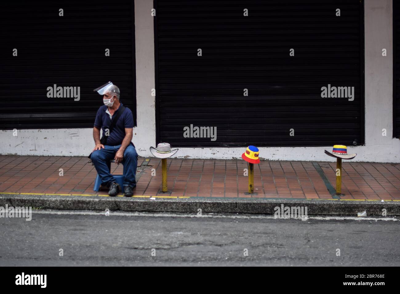 Ambulant hat seller during Coronavirus outbreak in Colombia Stock Photo