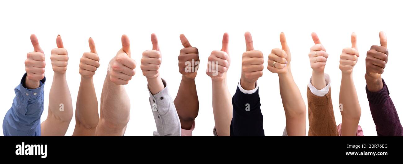 Close-up Of People's Hand Showing Thumb Up Sign Against Isolated On ...