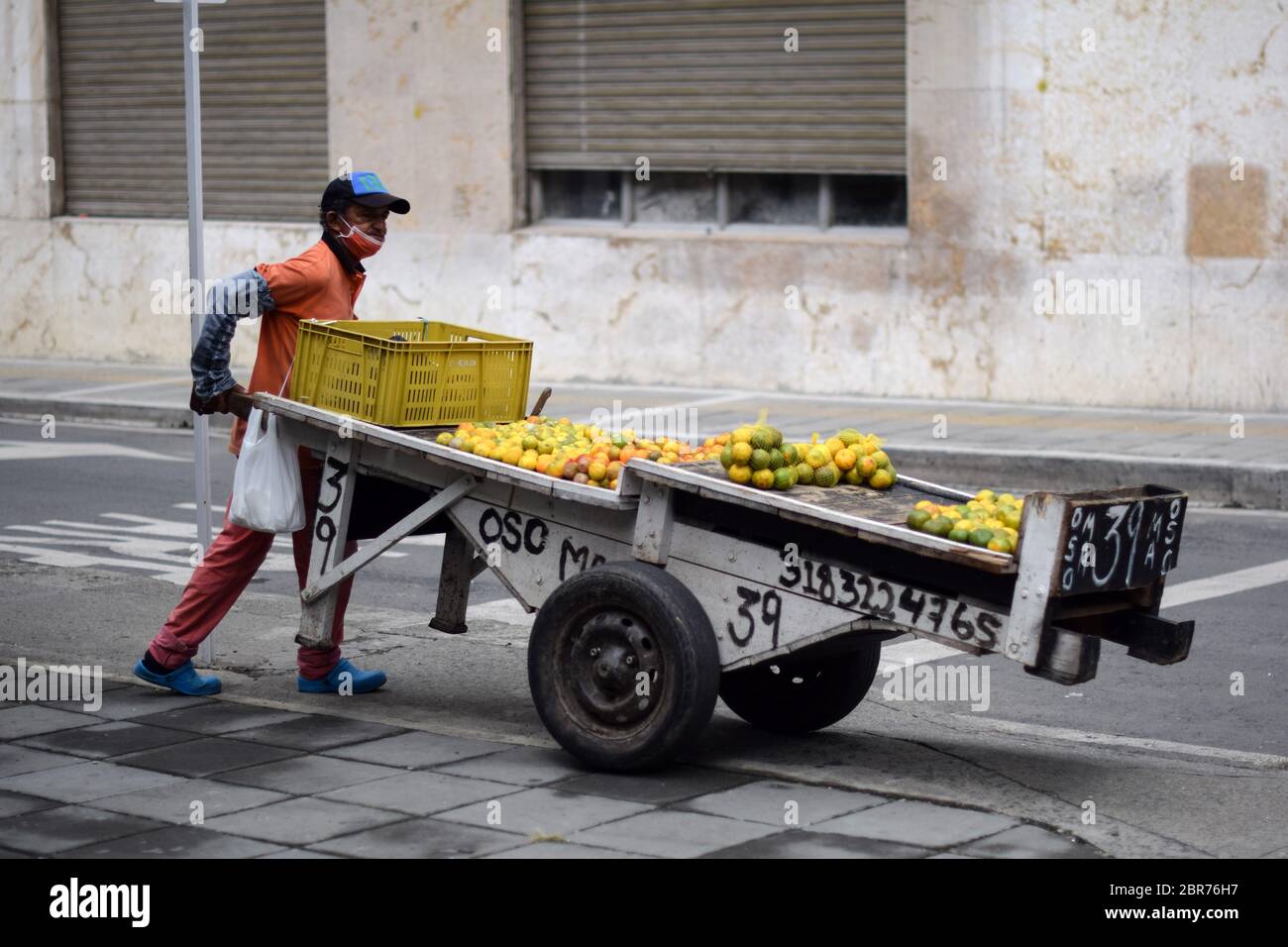 Street fruit seller working in city centre during Coronavirus outbreak in Colombia Stock Photo