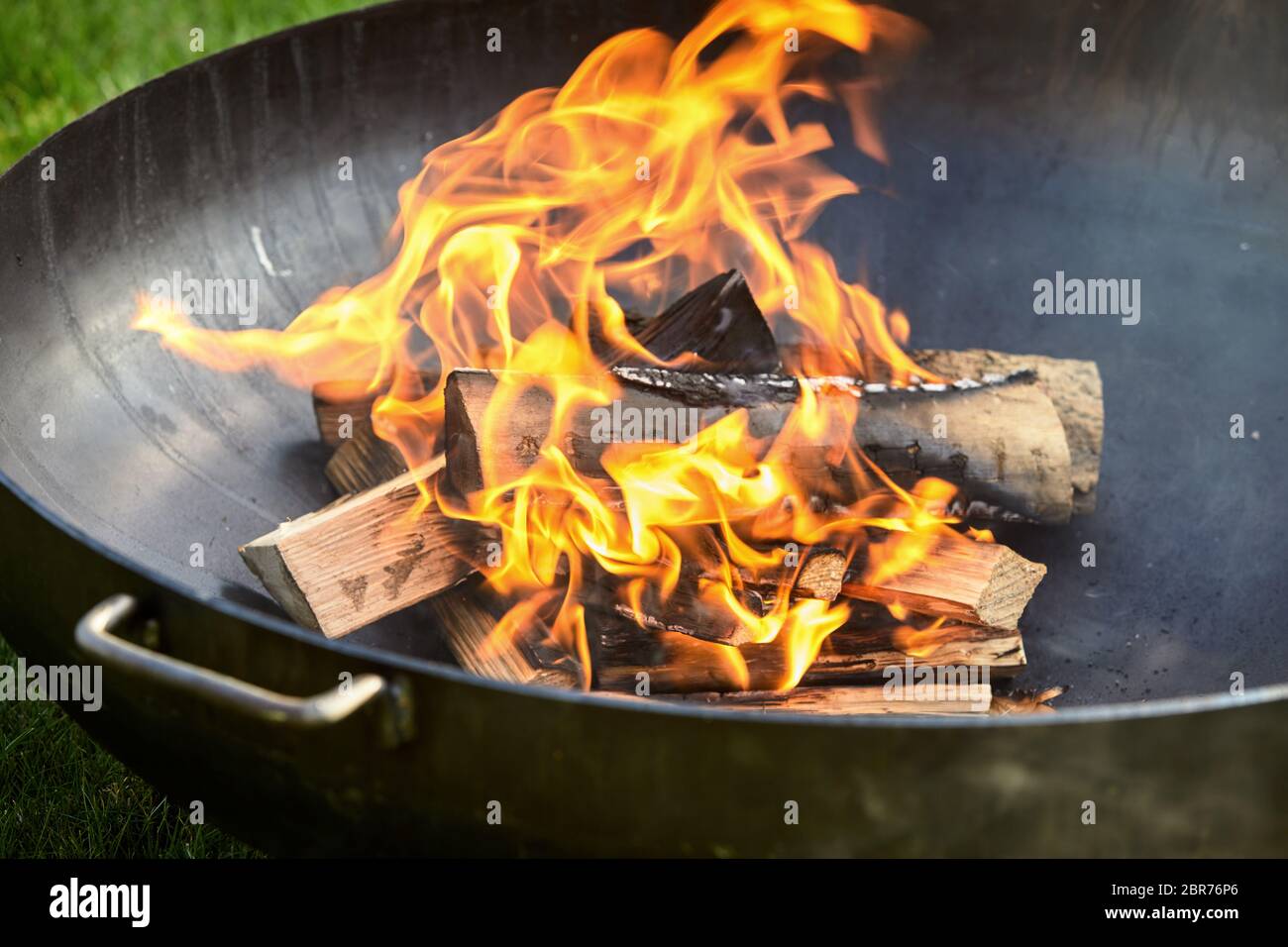 Blackened Logs On Fire Covered In Burn Marks While Sitting Inside Dark