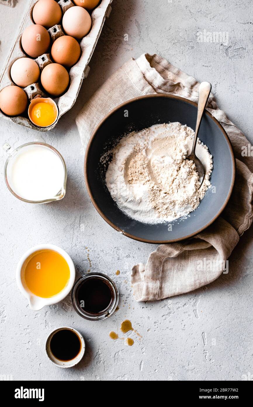 Alternative flour in a bowl with ingredients for pancake batter. Stock Photo