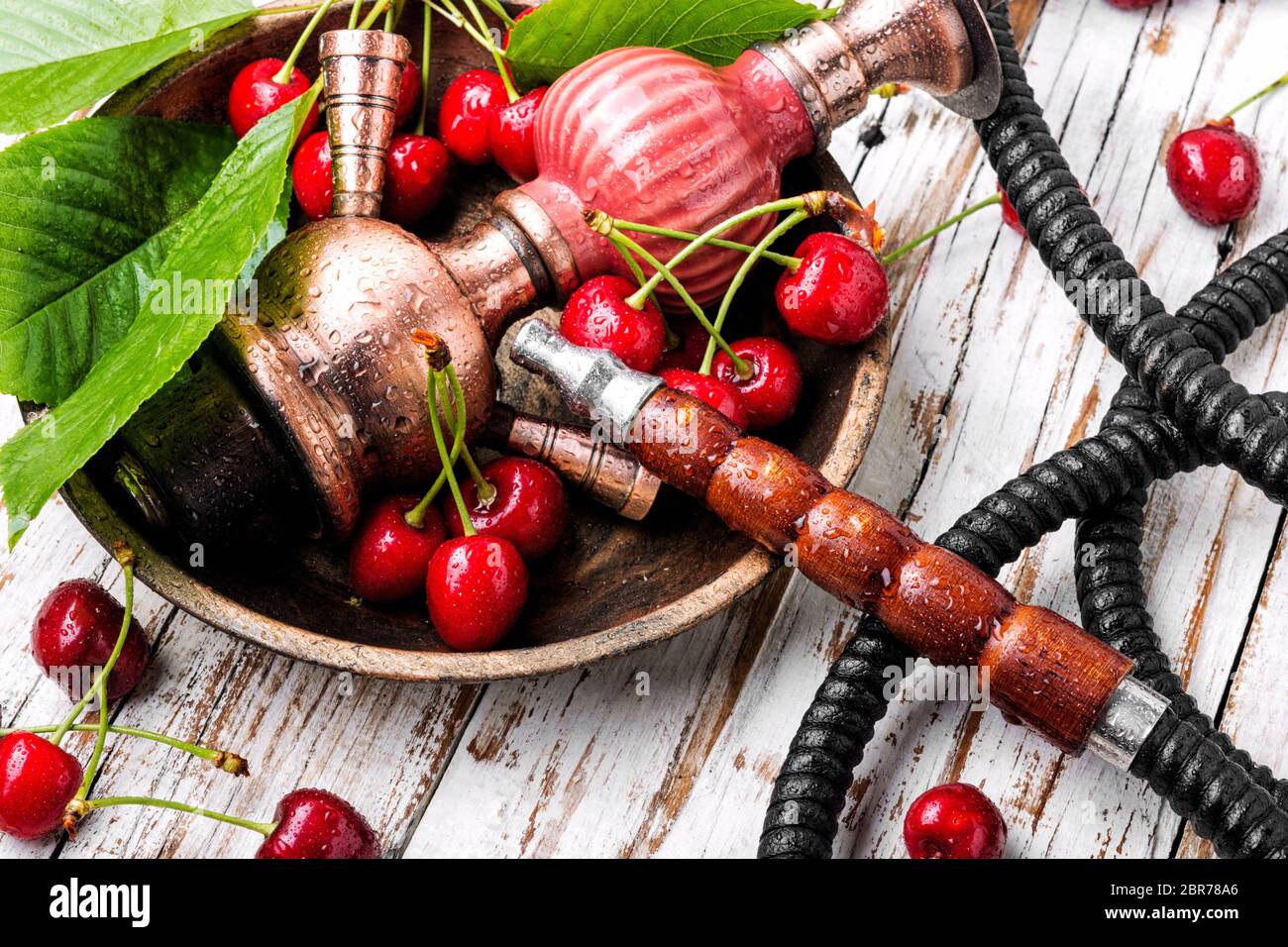Smoking hookah.Fruit shisha.Eastern smoking nargile with cherry flavor