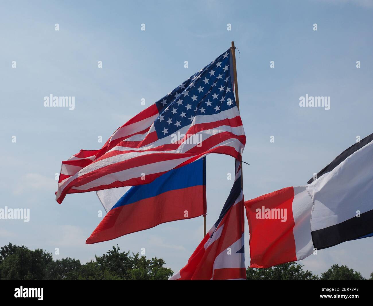 British, Russian and American flags in front of German Bundestag parliament Stock Photo