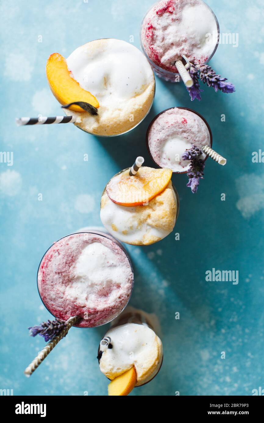 Various Ice cream floats with lavender and straws Stock Photo Alamy