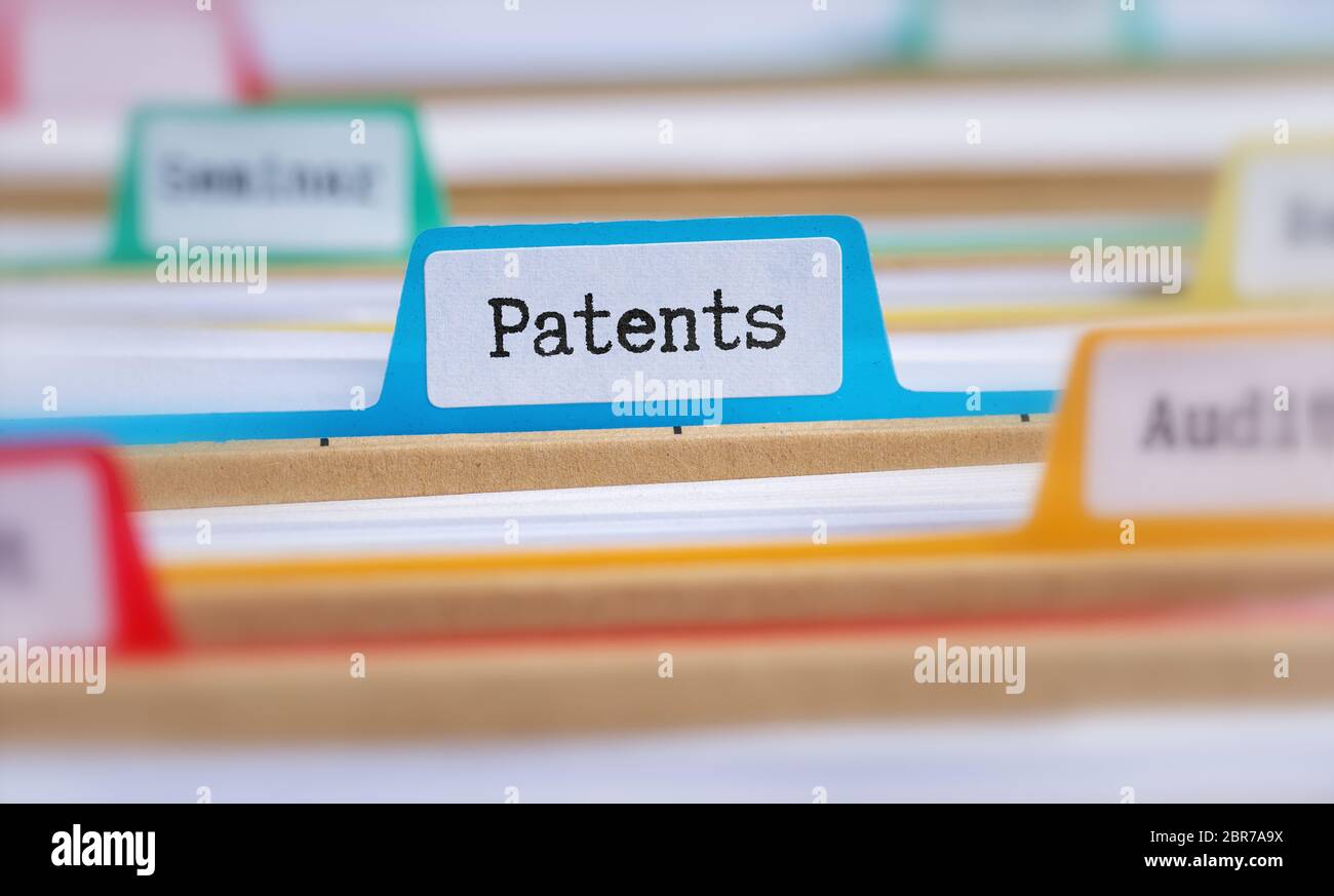 File folders with a tab labeled Patents Stock Photo