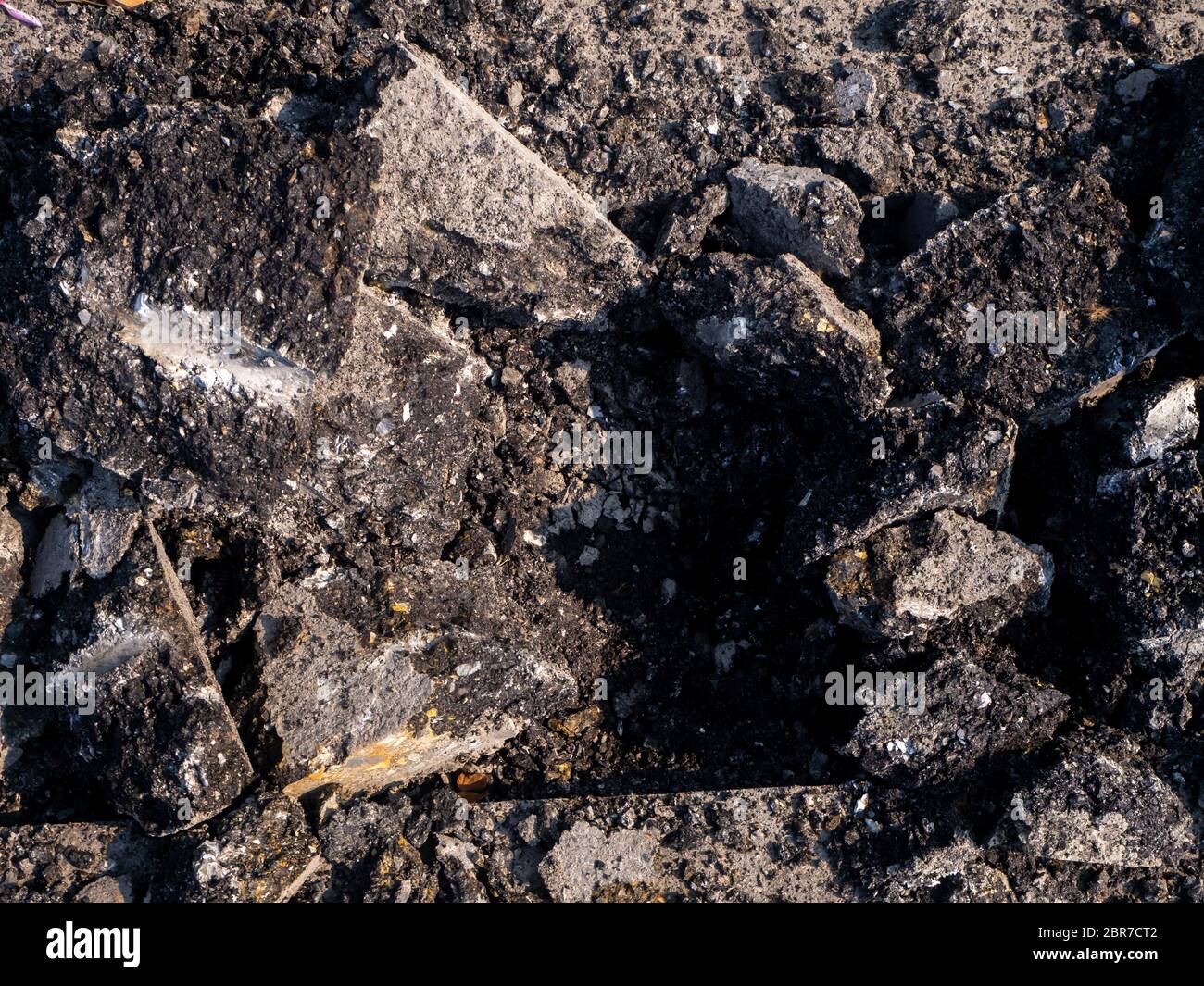 the Road repairing works with jackhammer. machine drills asphalt Stock Photo