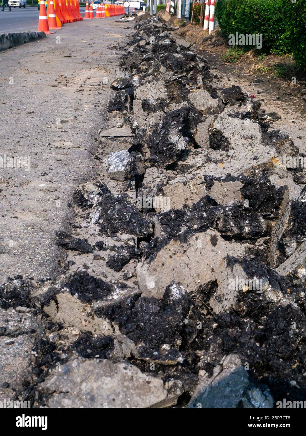 the Road repairing works with jackhammer. machine drills asphalt Stock Photo