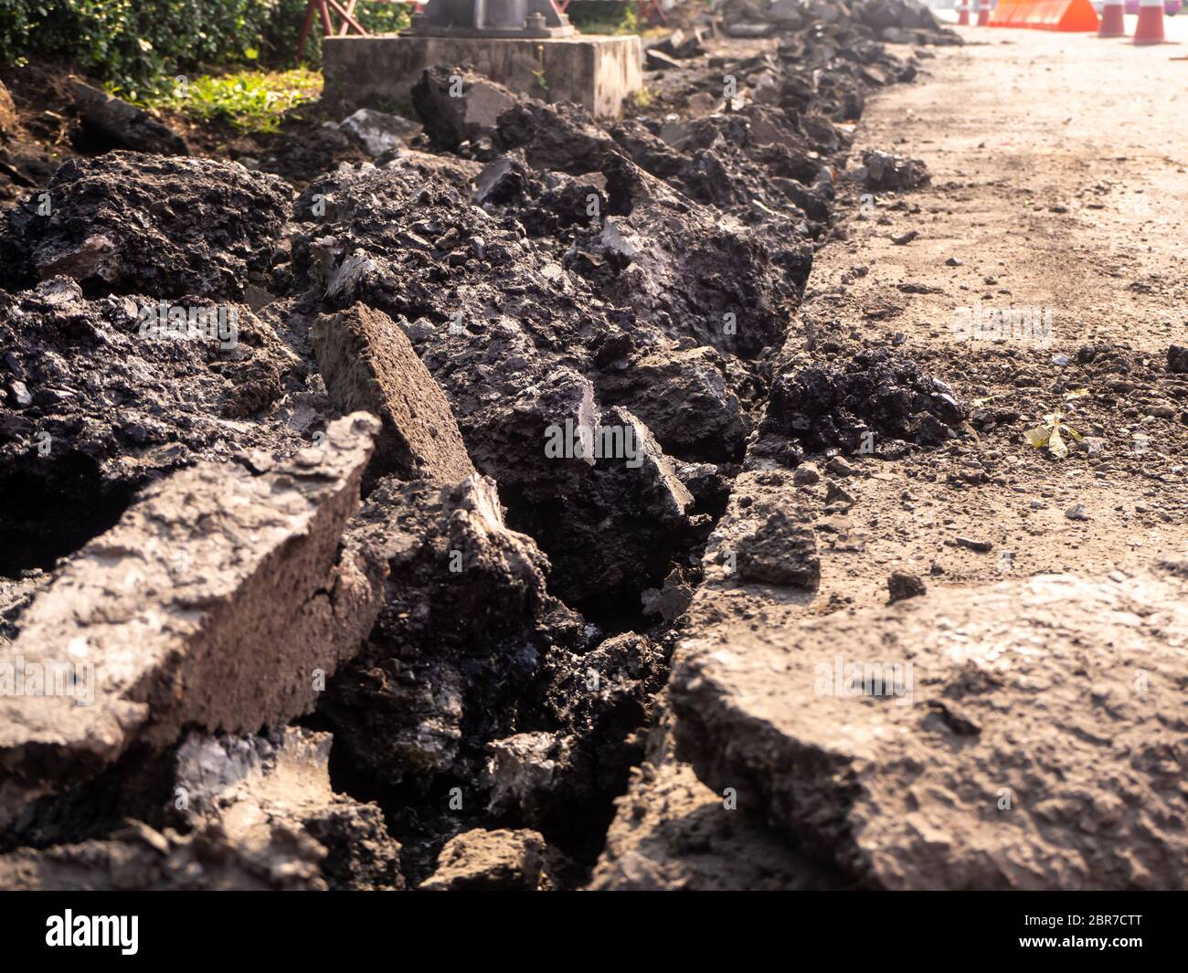 the Road repairing works with jackhammer. machine drills asphalt Stock Photo