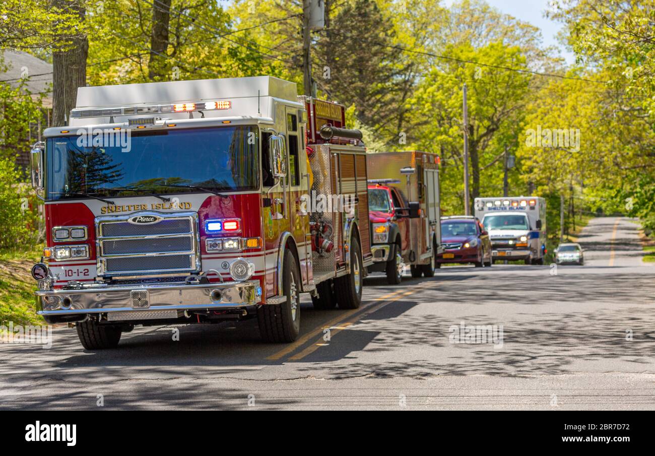 Several Shelter Island Emergency vehicles with lights on Stock Photo