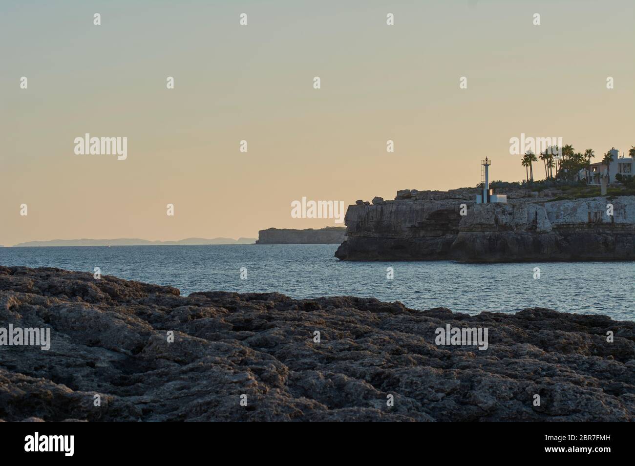 Small Lighthouse on Mallorca torre porto petro, water activities Stock Photo