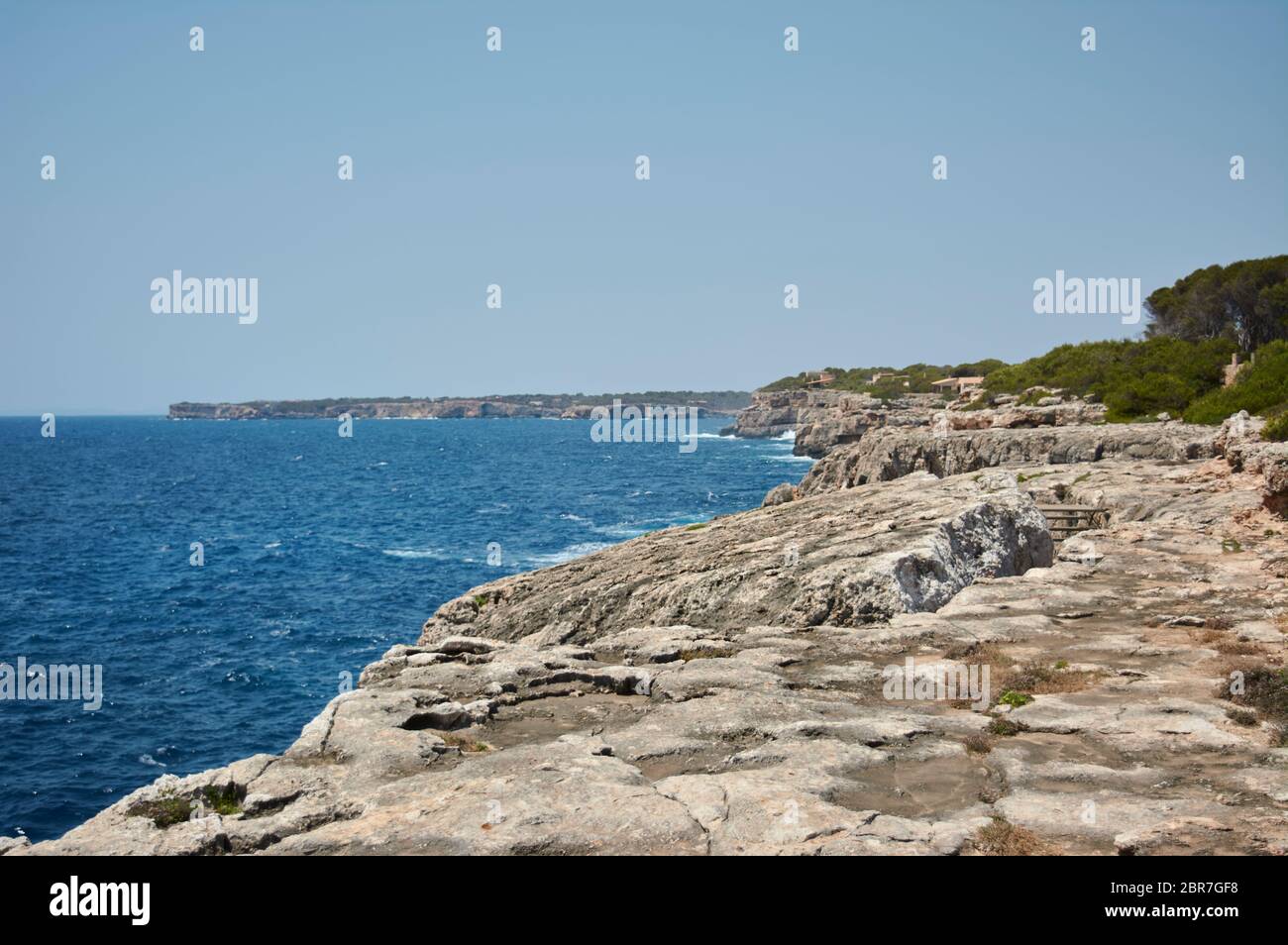 Small Lighthouse on Mallorca torre porto petro, water activities Stock Photo