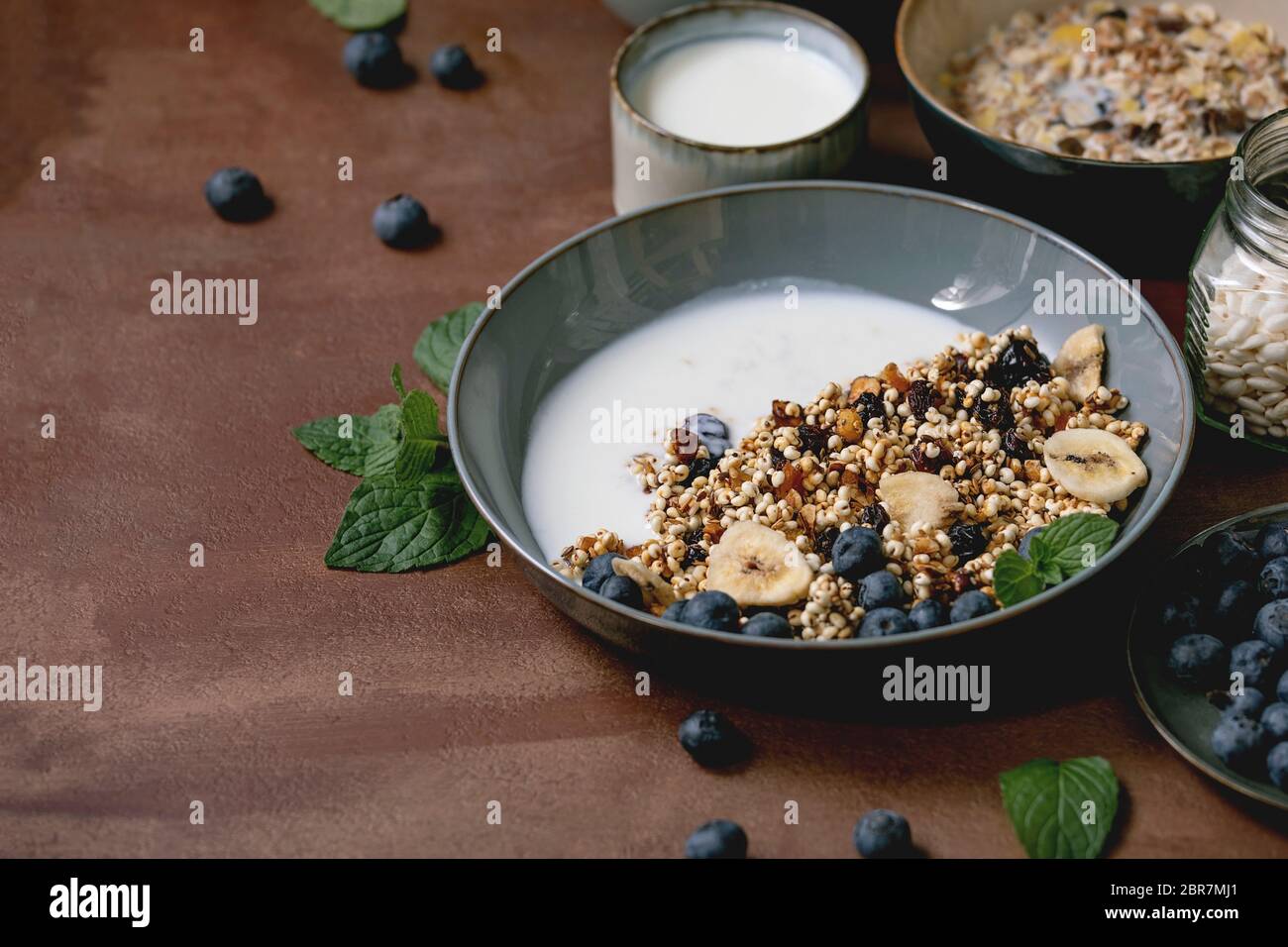Homemade crunchy puffed millet grain granola with dried fruits and nuts
