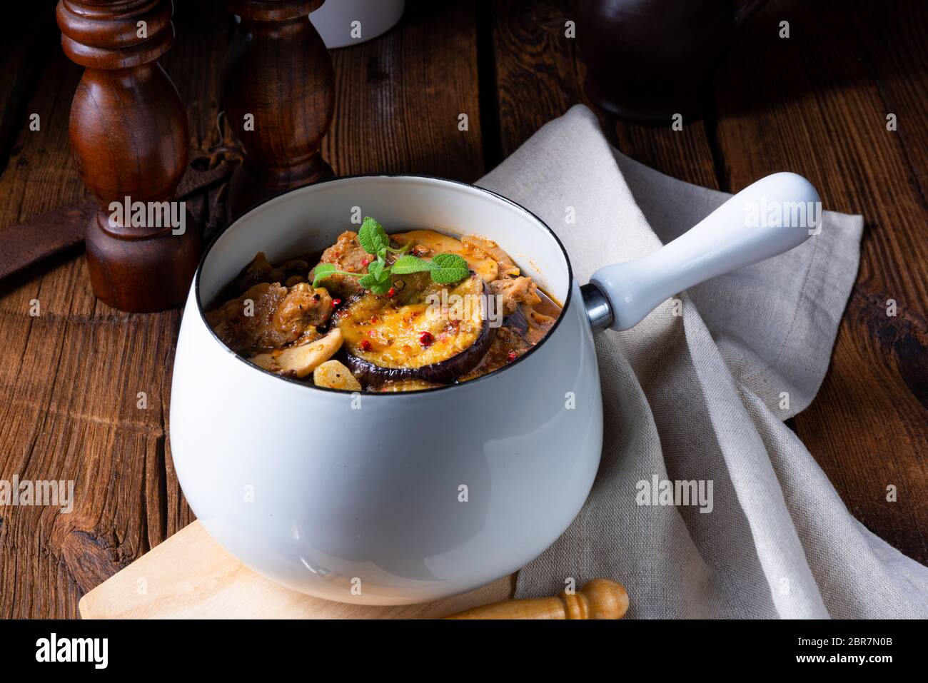 Veal goulash with baked aubergine and herbs Stock Photo - Alamy