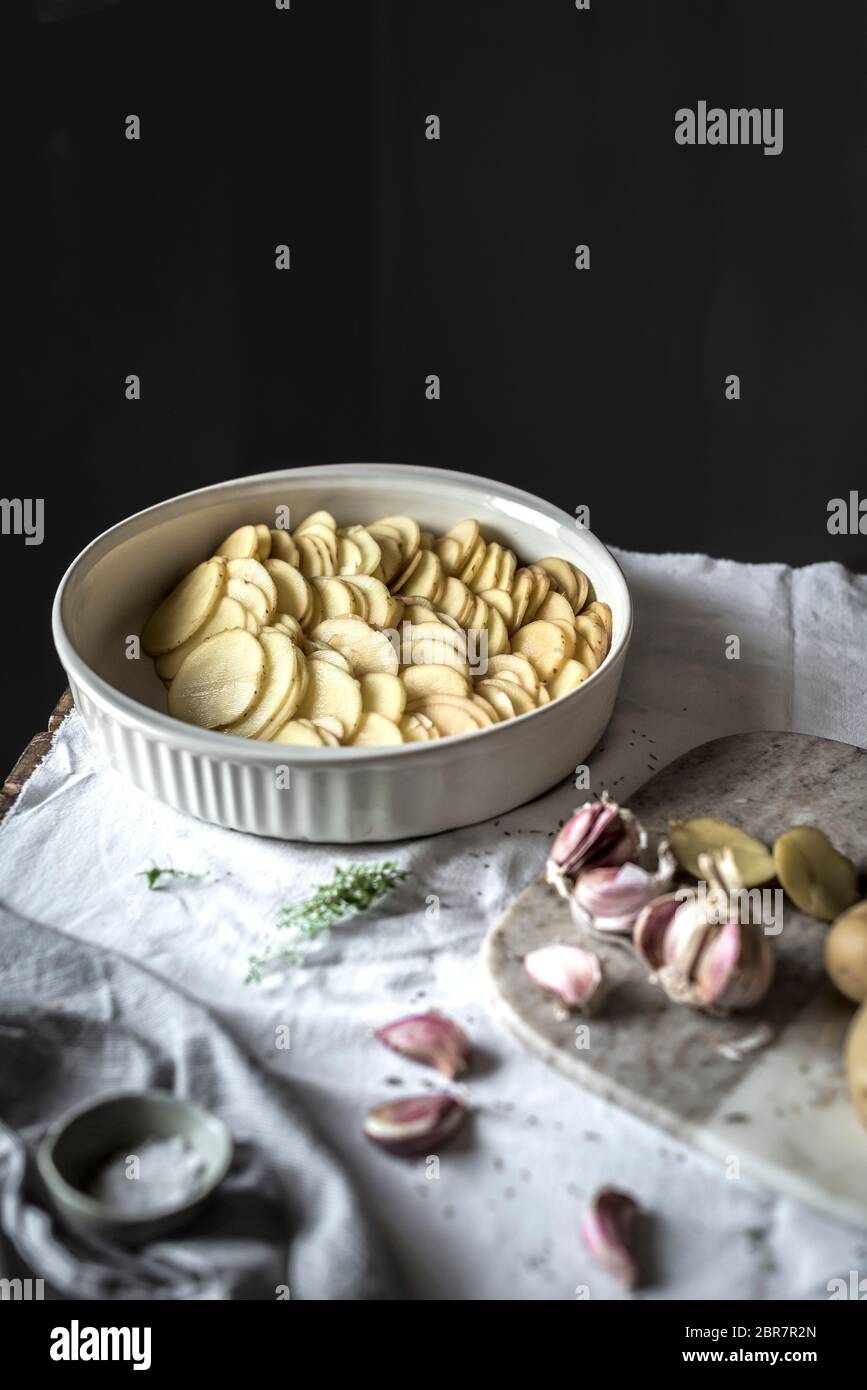 Making a potato gratin Stock Photo Alamy