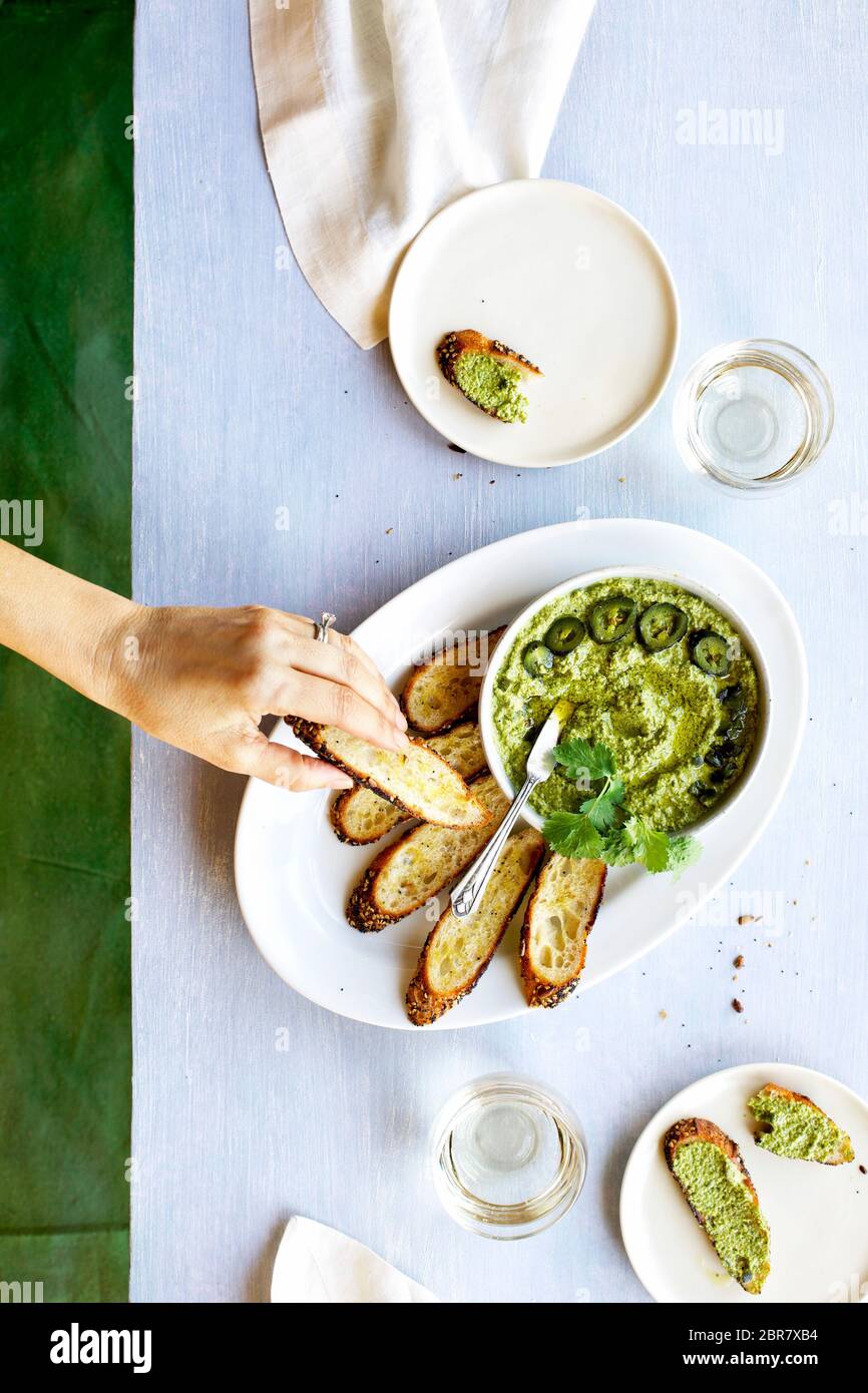 Roasted Jalapeno Cilantro Manchego Pesto with Crostini Stock Photo Alamy