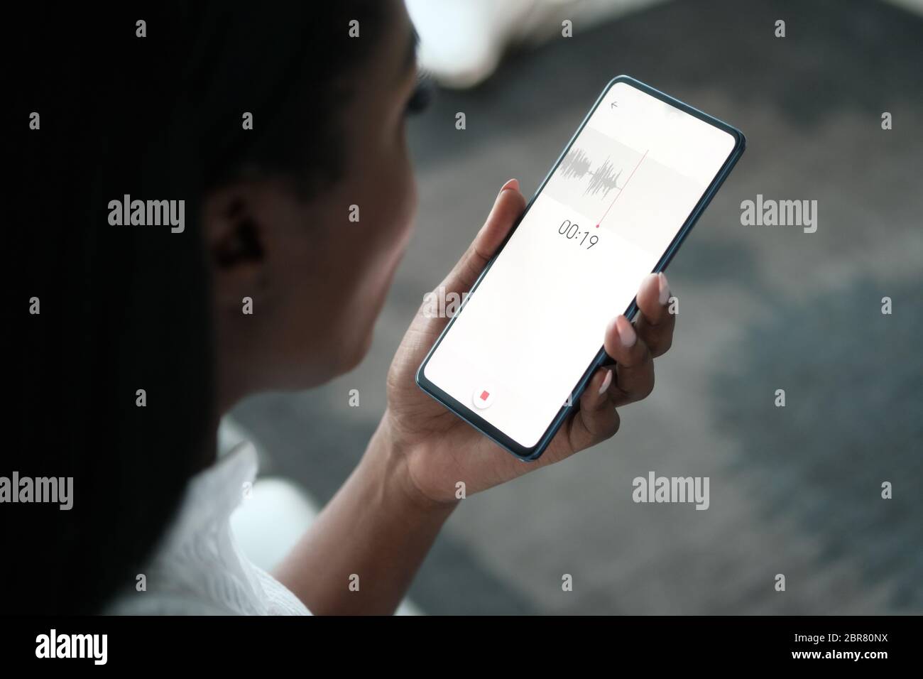 Black Woman Recording Voice Note On Mobile Phone Stock Photo