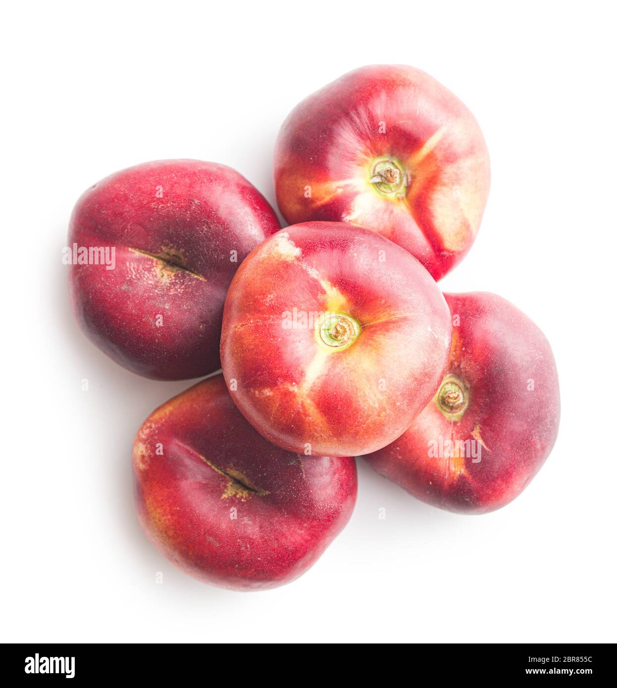 Ripe flat nectarines isolated on white background. Stock Photo