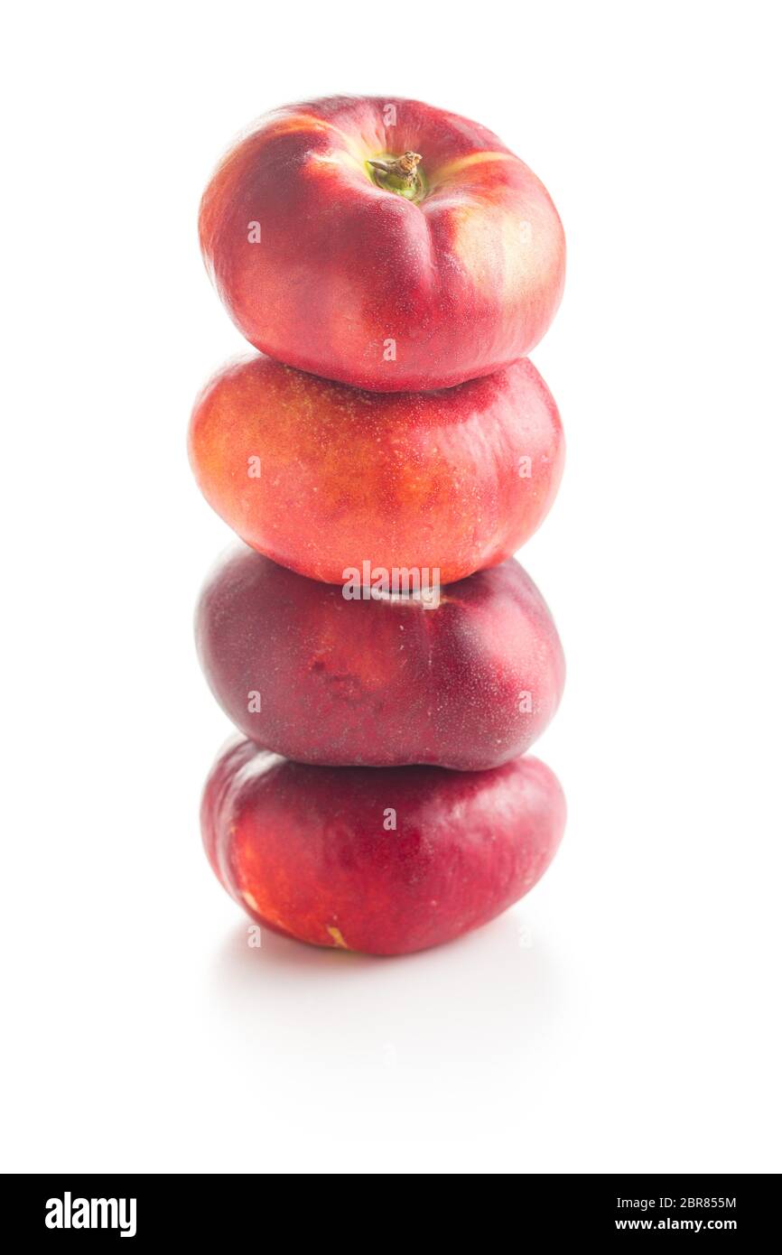 Ripe flat nectarines isolated on white background. Stock Photo