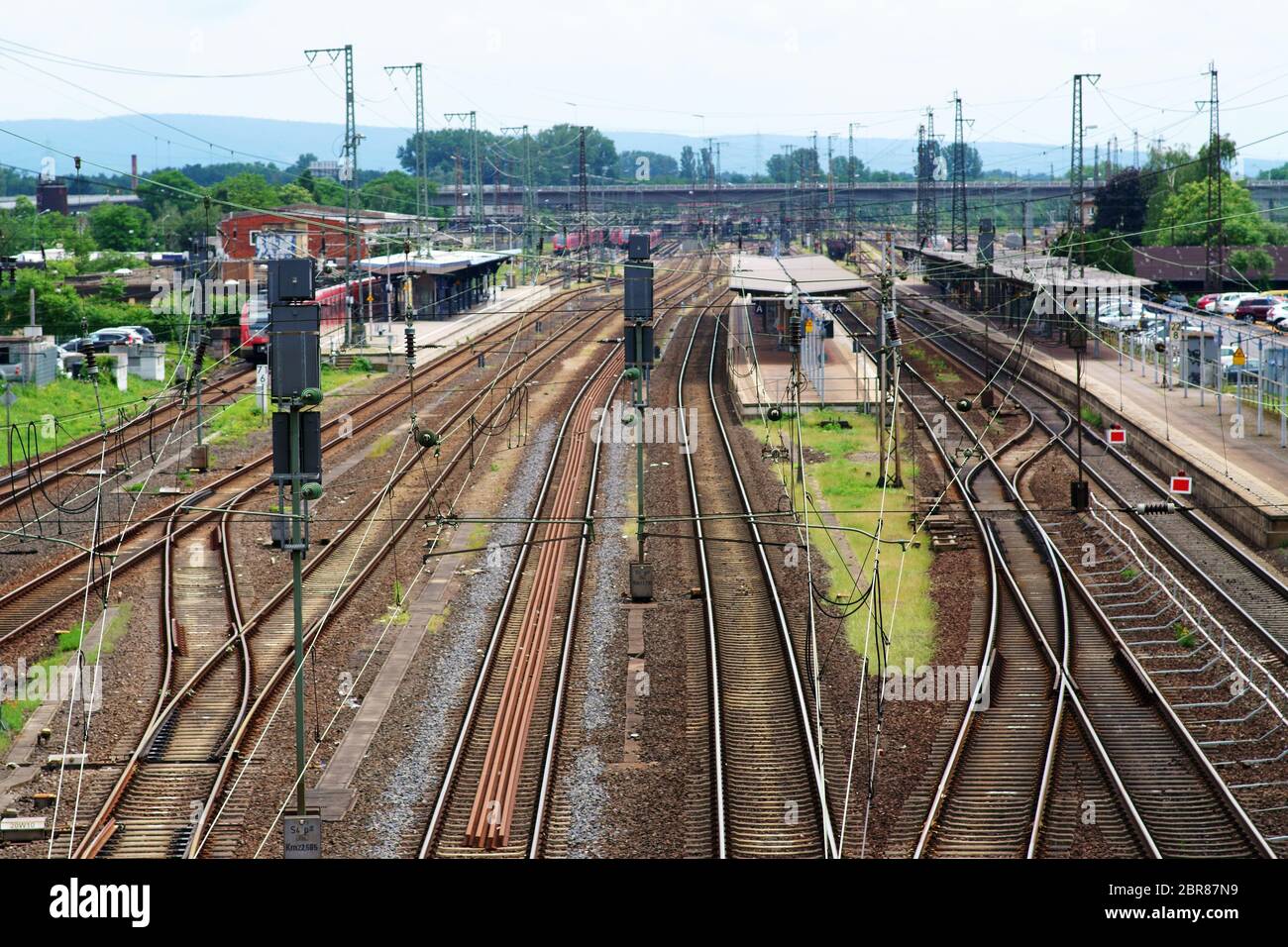 Adjacent tracks and platforms of the station Hanau with shelters. Stock Photo