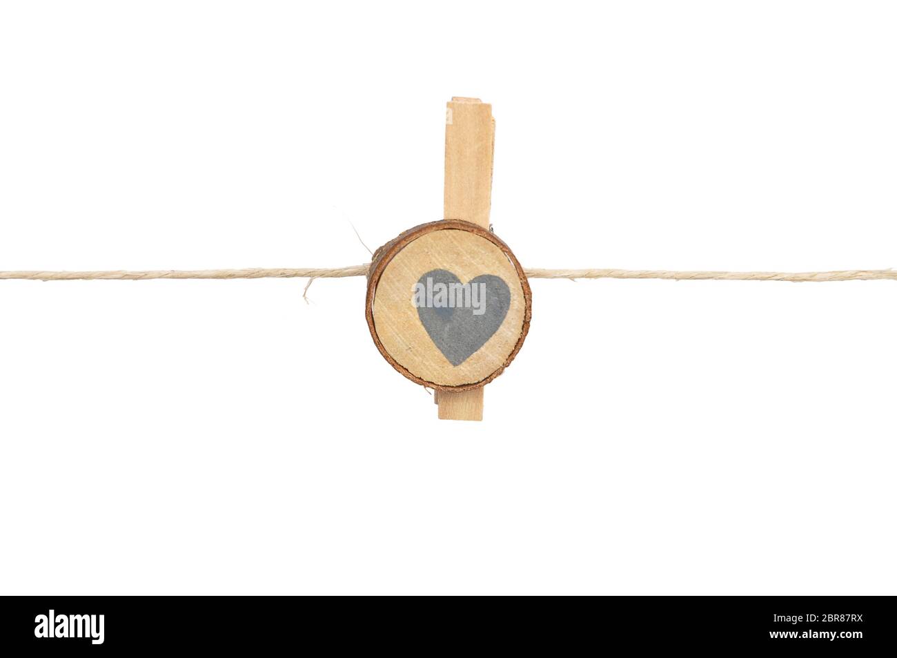 Twine and wooden peg on white background Stock Photo