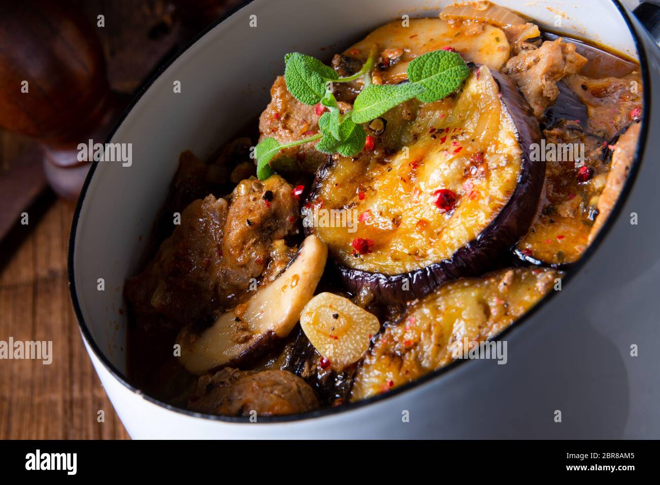 Veal goulash with baked aubergine and herbs Stock Photo - Alamy