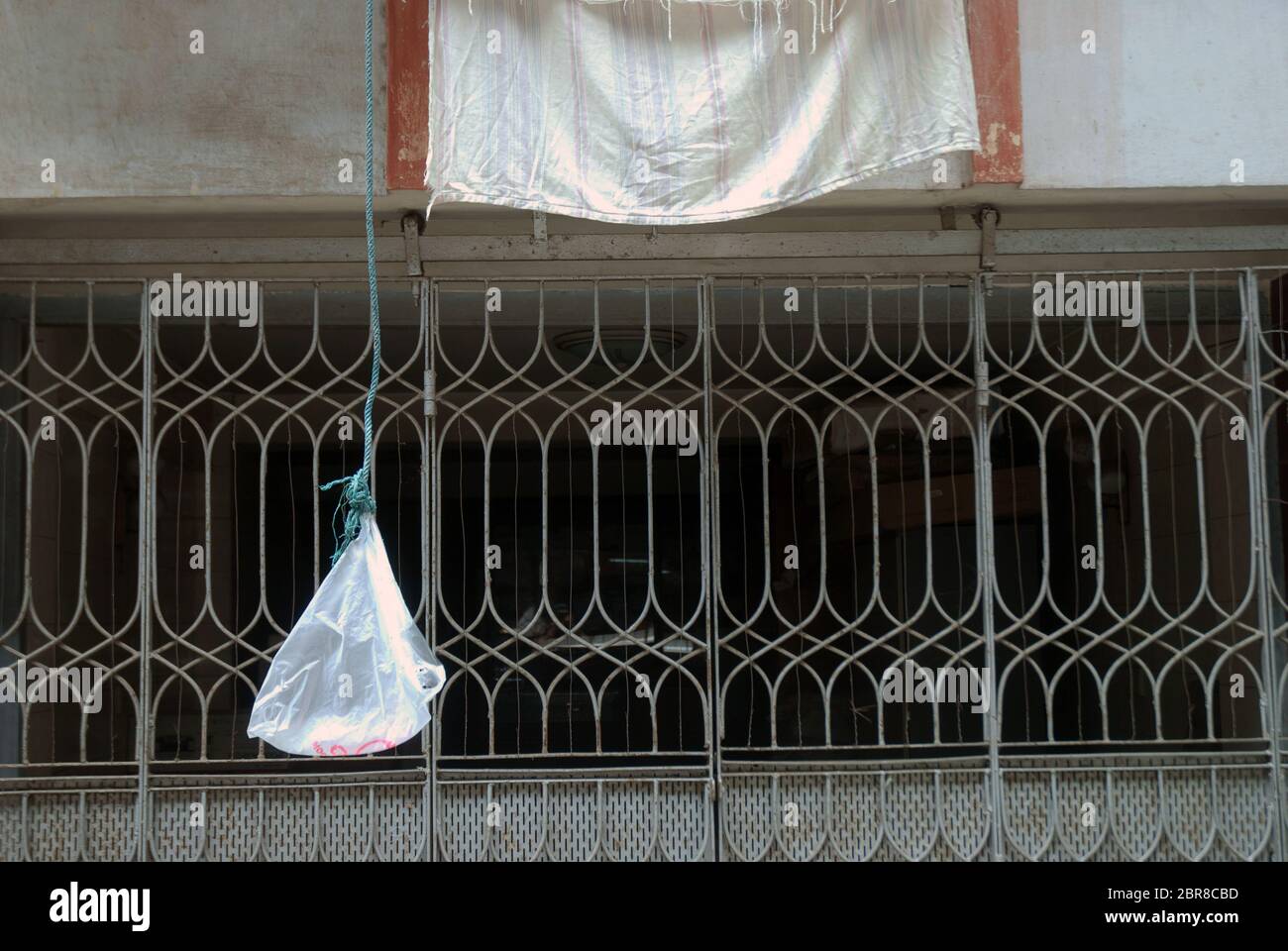 Empty plastic bag hanging from building, Yangon, Myanmar, Asia Stock