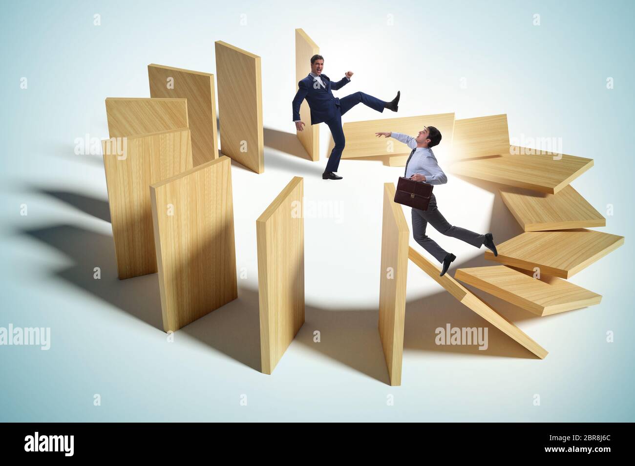 Domino effect and the competition concept Stock Photo - Alamy