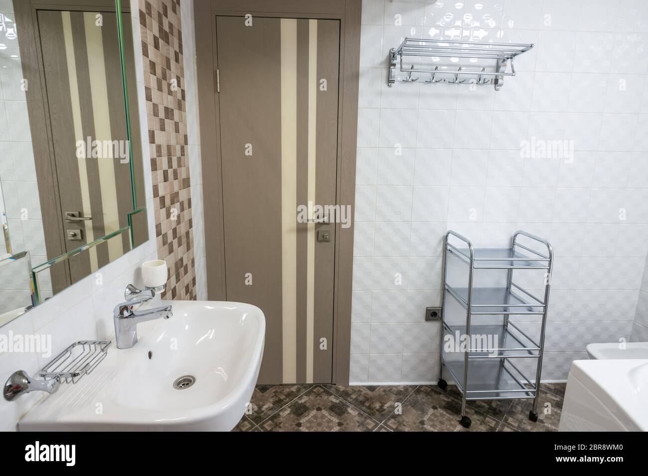 Interior of large bathroom, entrance view Stock Photo - Alamy